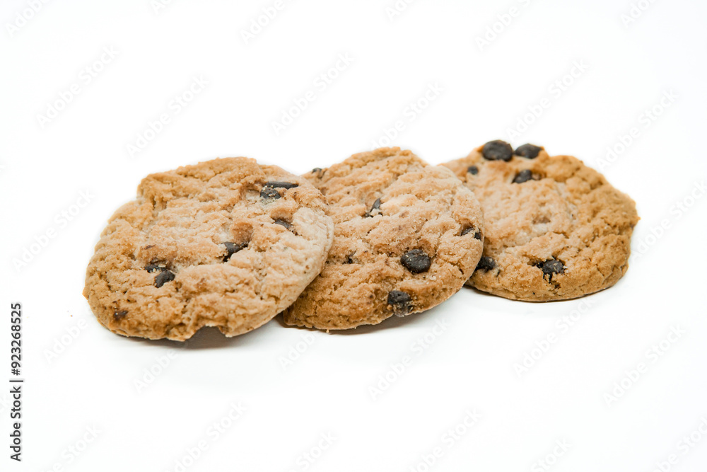 Isolated clipping path of dark chocolate chip cookie on white background. Biscuits with chocolate topping. Cookies isolated on white background Isolated clipping path of dark chocolate chip cookie on white background. Biscuits with chocolate topping. Cookies isolated on white background