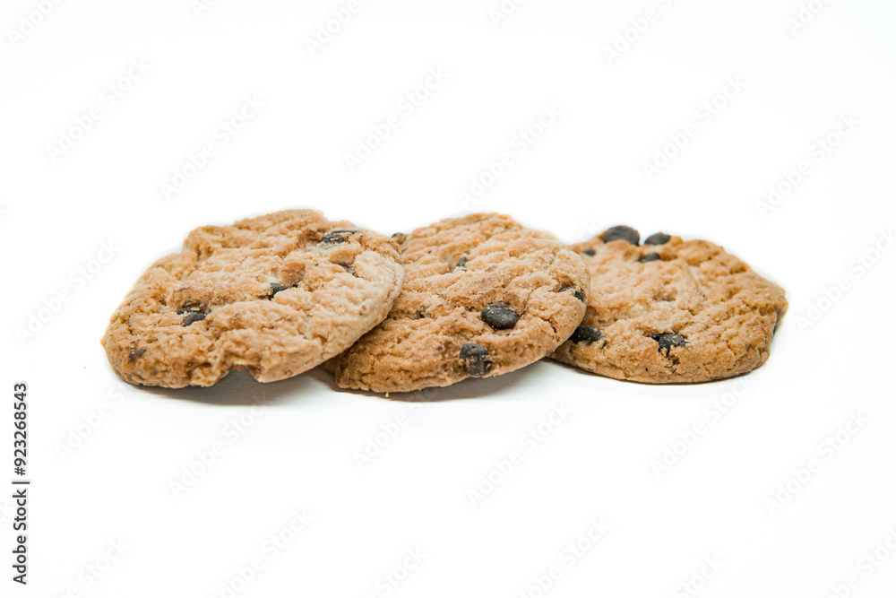 Isolated clipping path of dark chocolate chip cookie on white background. Biscuits with chocolate topping. Cookies isolated on white background Isolated clipping path of dark chocolate chip cookie on white background. Biscuits with chocolate topping. Cookies isolated on white background