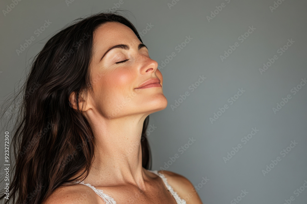 A close up of a woman's face with her eyes closed A close up of a woman's face with her eyes closed
