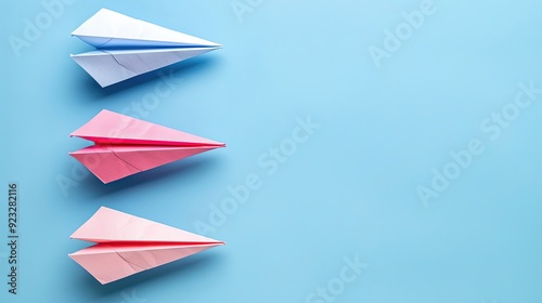 Three paper airplanes are on a blue background