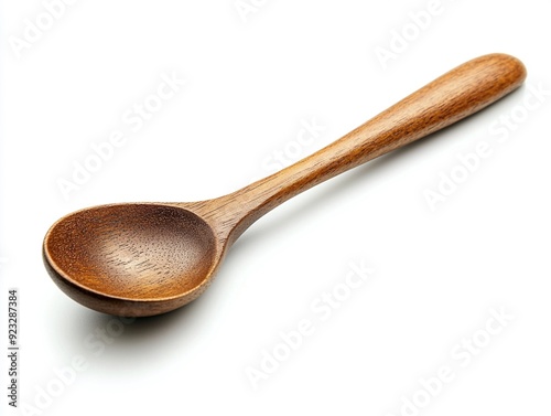 A brown wooden spoon on a white background photo