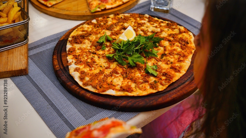 Turkish Pizza With Parsley and Lemon Wedge Turkish Pizza With Parsley and Lemon Wedge