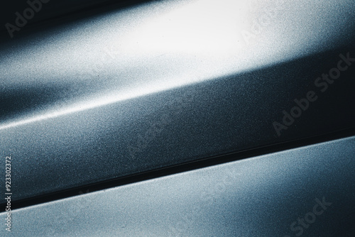 A shiny silver surface with a lot of texture. The surface is reflective and has a metallic sheen