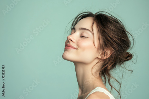 A close up of a woman's face with her eyes closed