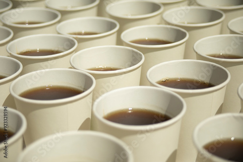 Tea in glasses. Lots of white drinking glasses. Tea on the street.