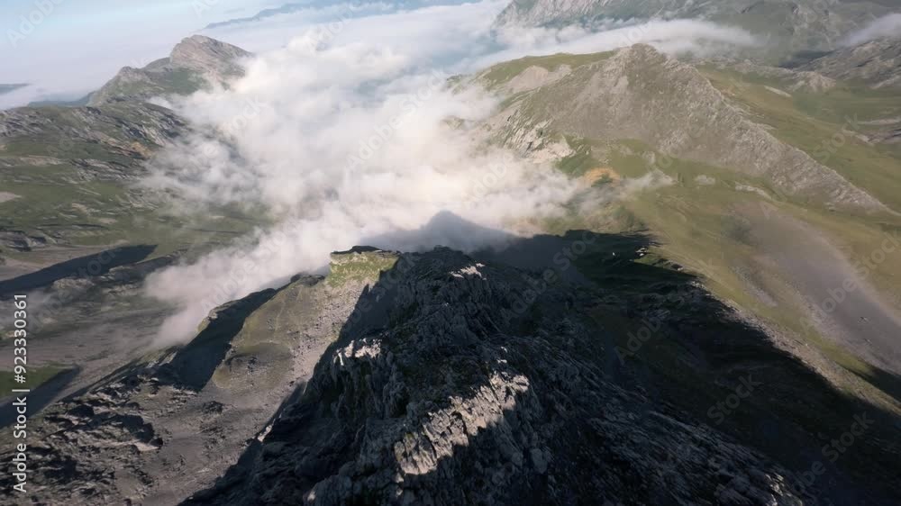 Panoramic landscape of mountains and clouds, aerial FPV view Panoramic landscape of mountains and clouds, aerial FPV view