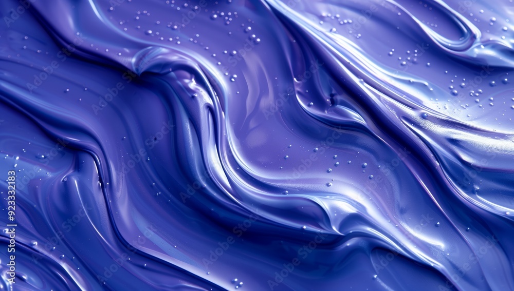 A closeup of blue paint, with swirling patterns and textures liquid. A closeup of blue paint, with swirling patterns and textures liquid.