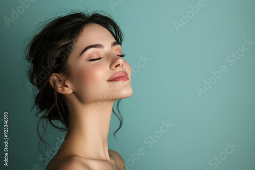 A close up of a woman's face with her eyes closed