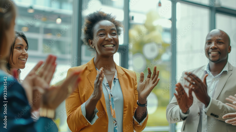 Fototapeta premium Business conference: diverse team members applauding a female speaker in a circle, showing appreciation and encouragement
