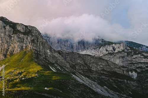 Epic Sunset over Incredible Driving Road - sunburst on Durmitor National Park Mountains. Sedlo Pass and Bobotov Kuk Adventure, Montenegro - the foot of the Balkan Alps