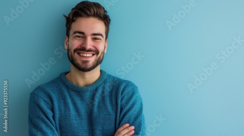 The smiling man in blue