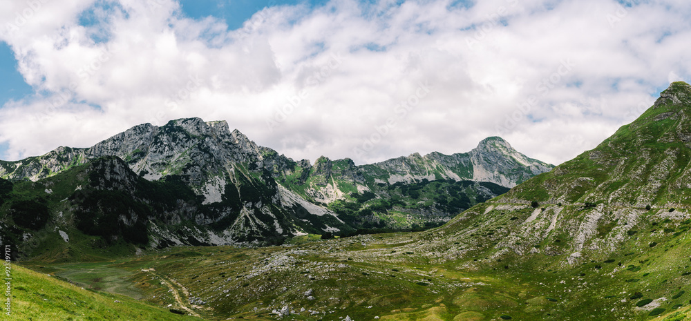 Fototapeta premium Epic Panoramic View of Ranisava Mountain Range in Durmitor National Park, Montenegro with Sedlo Pass - Incredible Mountains and Hiking Area - The Balkan Alps Panorama