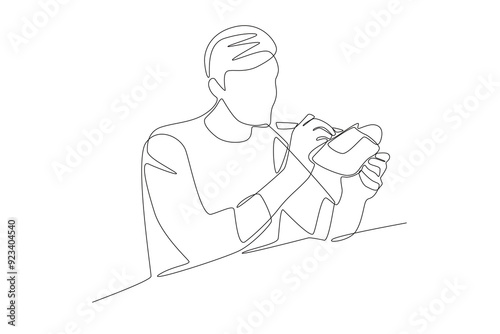 The shoemaker is sculpting shoes. Handmade concept one-line drawing