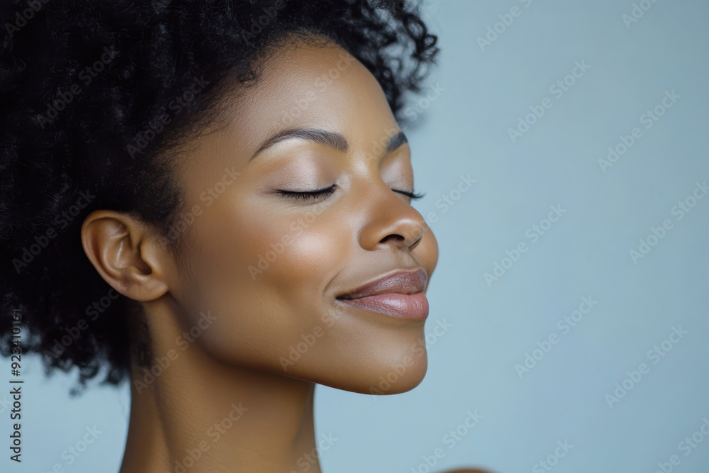 A close up of a black woman's face with her eyes closed A close up of a black woman's face with her eyes closed
