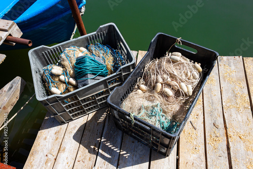 Two plastic crates with fishing nets on a fishing construction at Rezovo River, village of Rezovo, Tsarevo Municipality, Province of Burgas, Bulgaria photo