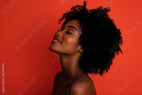 A close up of a black woman's face with her eyes closed