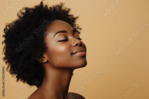 A close up of a black woman's face with her eyes closed