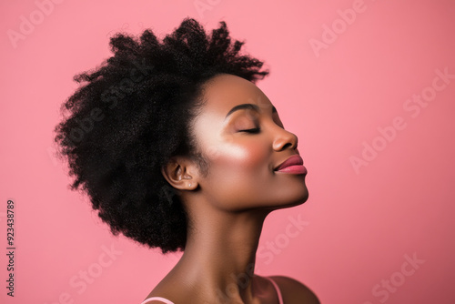 A close up of a black woman's face with her eyes closed