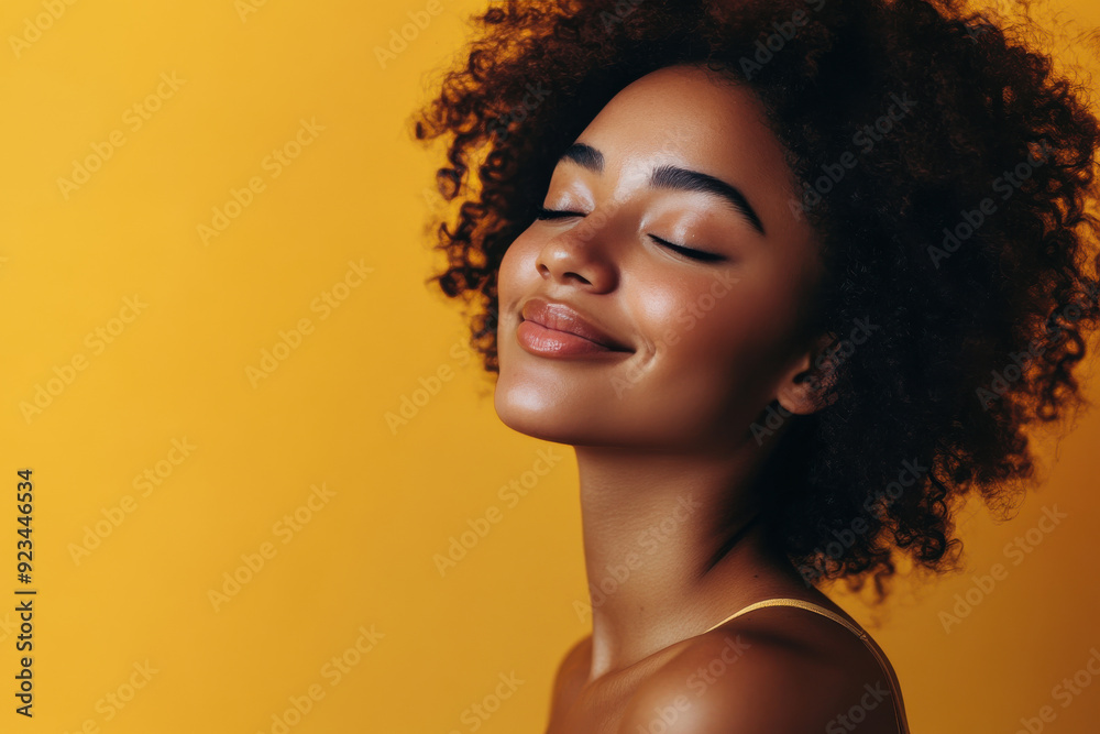 A close up of a black woman's face with her eyes closed A close up of a black woman's face with her eyes closed
