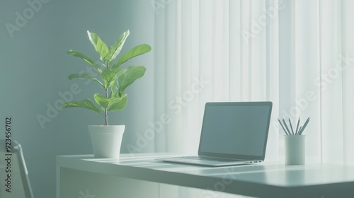 Minimalist Home Office Desk with Laptop, Plant, and Pencils.