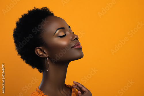 A close up of a black woman's face with her eyes closed