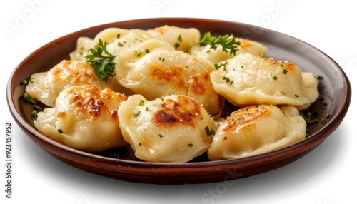 Deliciously golden-brown dumplings served on a rustic wooden plate with fresh herbs