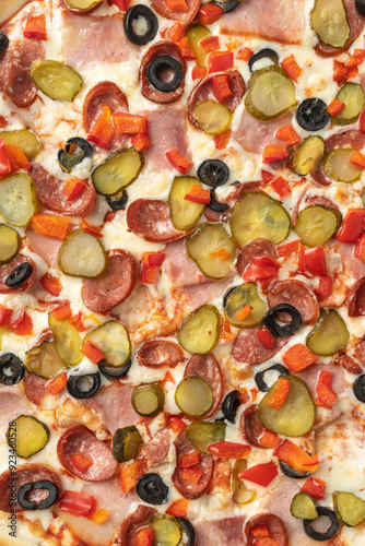 the macro composition of pizza for the menu. fresh ingredients are cheese, ham and tomatoes.