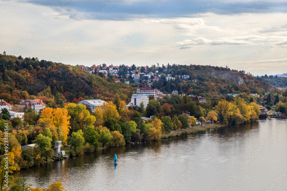 view of autumn Prague, green and orange trees and red roofs of houses, Prague in October view of autumn Prague, green and orange trees and red roofs of houses, Prague in October