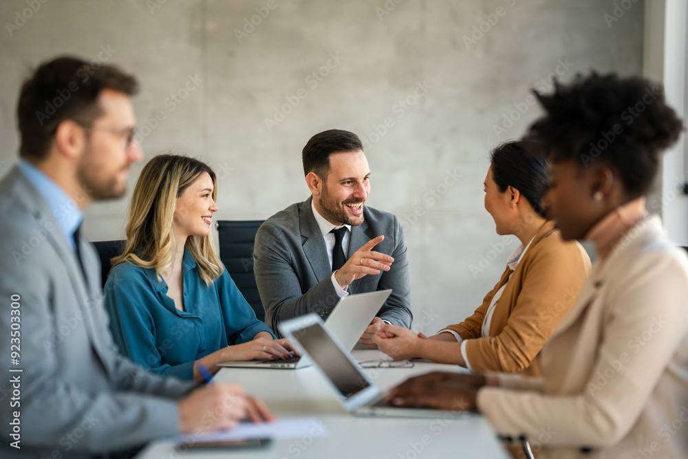 Successful business professionals presenting analytical report, working together in corporate office Successful business professionals presenting analytical report, working together in corporate office