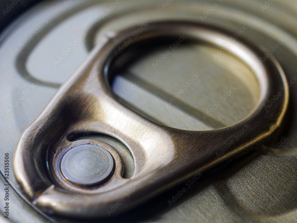 Close-up of Aluminum can lid ring that holds food. macro,top view Close-up of Aluminum can lid ring that holds food. macro,top view