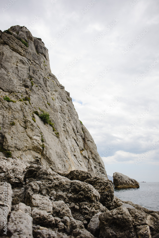 The landscape of the rocky coast of the Crimean Peninsula. Sea, sky and mountains The landscape of the rocky coast of the Crimean Peninsula. Sea, sky and mountains