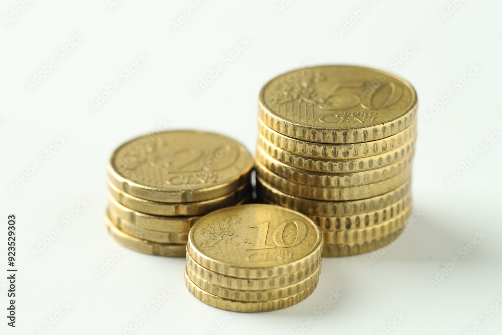 Stacked euro coins on white background, closeup Stacked euro coins on white background, closeup