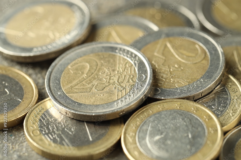 Many euro coins on table, closeup view Many euro coins on table, closeup view