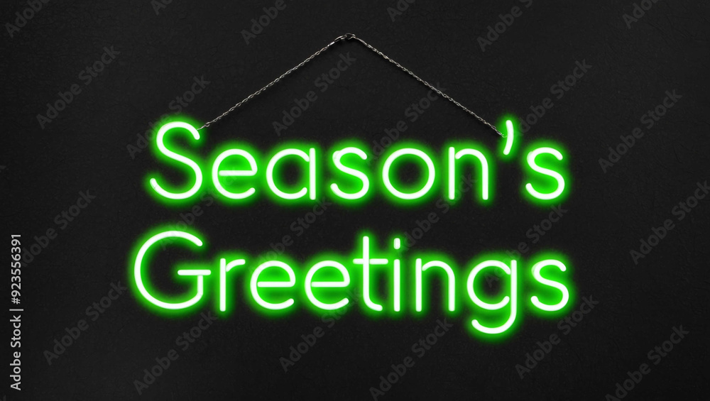 seasons greetings green neon lettering on plain dark black background seasons greetings green neon lettering on plain dark black background