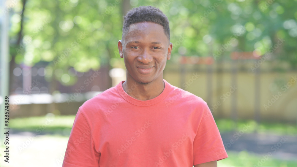 Casual African Man Shaking Head in Acceptance while Standing Outdoor Casual African Man Shaking Head in Acceptance while Standing Outdoor