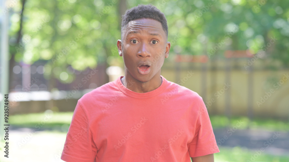 Casual African Man Reacting to Failure while Standing Outdoor Casual African Man Reacting to Failure while Standing Outdoor