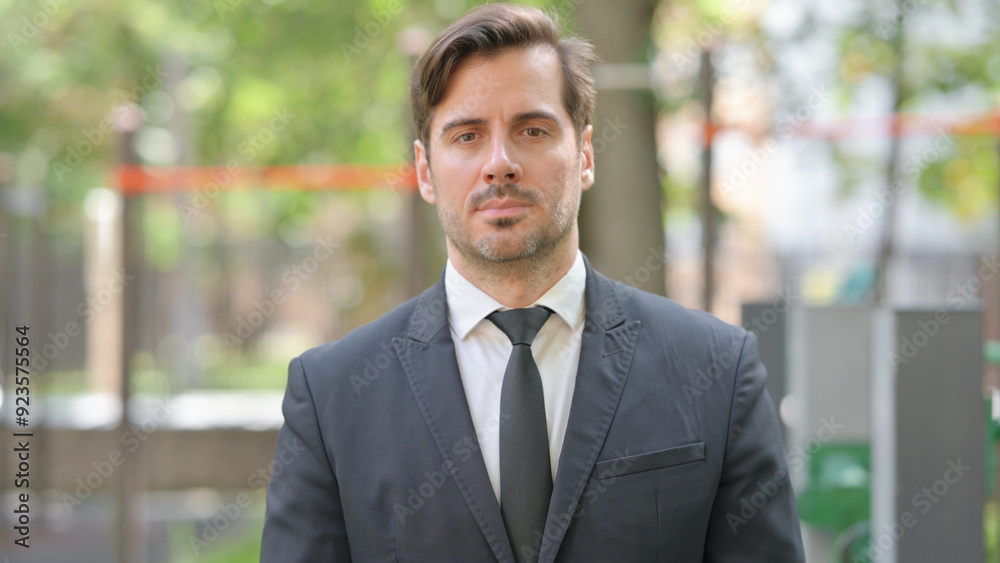Portrait of Serious Young Businessman Outdoor