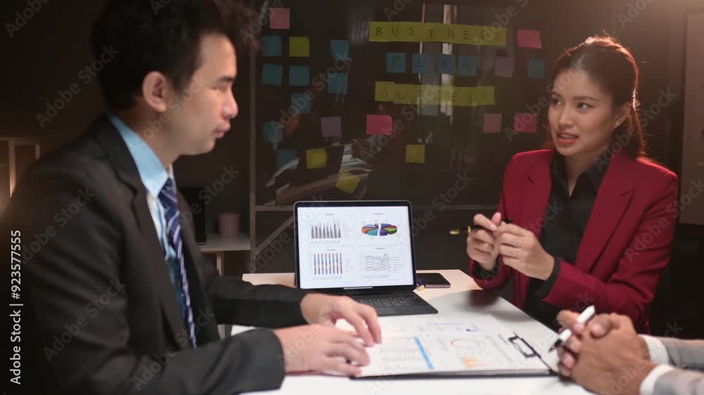 Collaborative business meeting with detailed data analysis and discussion Collaborative business meeting with detailed data analysis and discussion