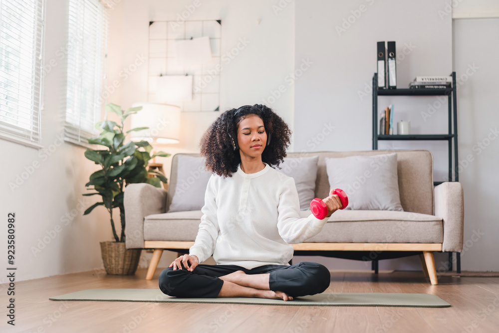 African American Woman Exercising with Dumbbell at Home. African American Woman Exercising with Dumbbell at Home.