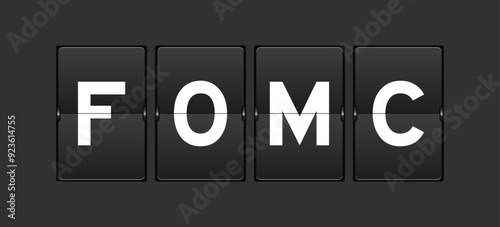Black color analog flip board with word FOMC (abbreviation of federal open market committee) on gray background