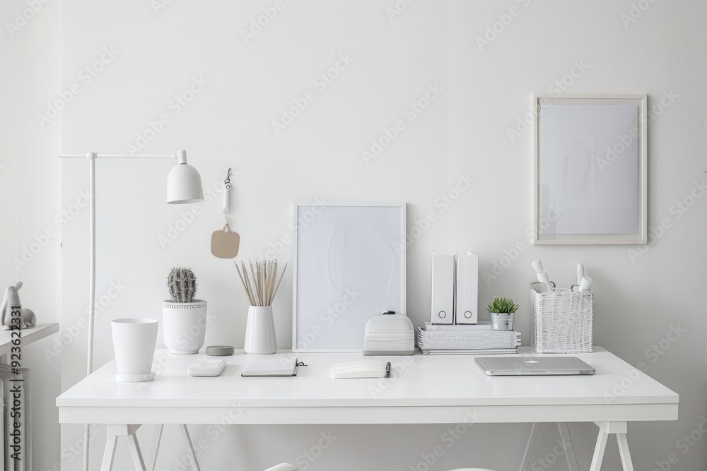 Minimalistic white home office with a white desk and minimal decor, emphasizing a clutter-free workspace. Minimalistic white home office with a white desk and minimal decor, emphasizing a clutter-free workspace.