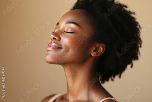 A close up of a black woman's face with her eyes closed