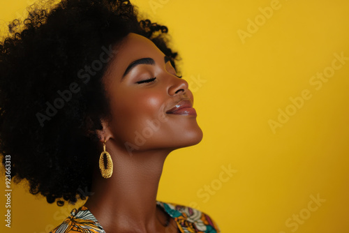 A close up of a black woman's face with her eyes closed