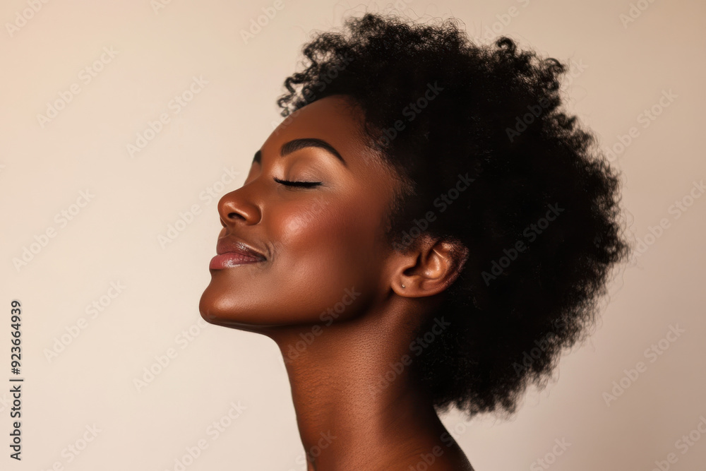 A close up of a black woman's face with her eyes closed A close up of a black woman's face with her eyes closed