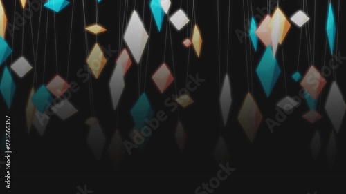 Hanging colored crystals in a unique abstract arrangement against a dark background. The crystals, connected by thin lines, appear to float in space, creating a delicate and ethereal scene. Copyspace