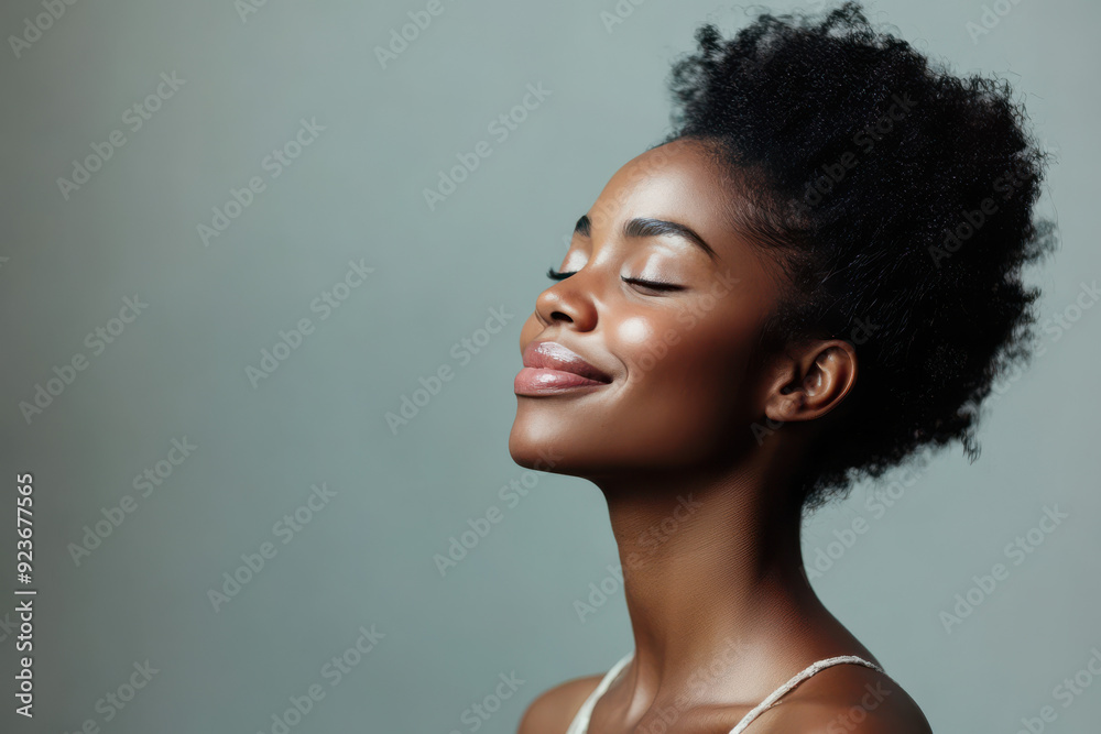 A close up of a black woman's face with her eyes closed A close up of a black woman's face with her eyes closed