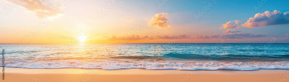 Breathtaking sunset over the ocean with vibrant colors, gentle waves, and soft sandy beach, creating a serene and tranquil coastal scene.