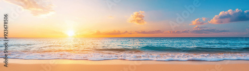 Breathtaking sunset over the ocean with vibrant colors, gentle waves, and soft sandy beach, creating a serene and tranquil coastal scene.