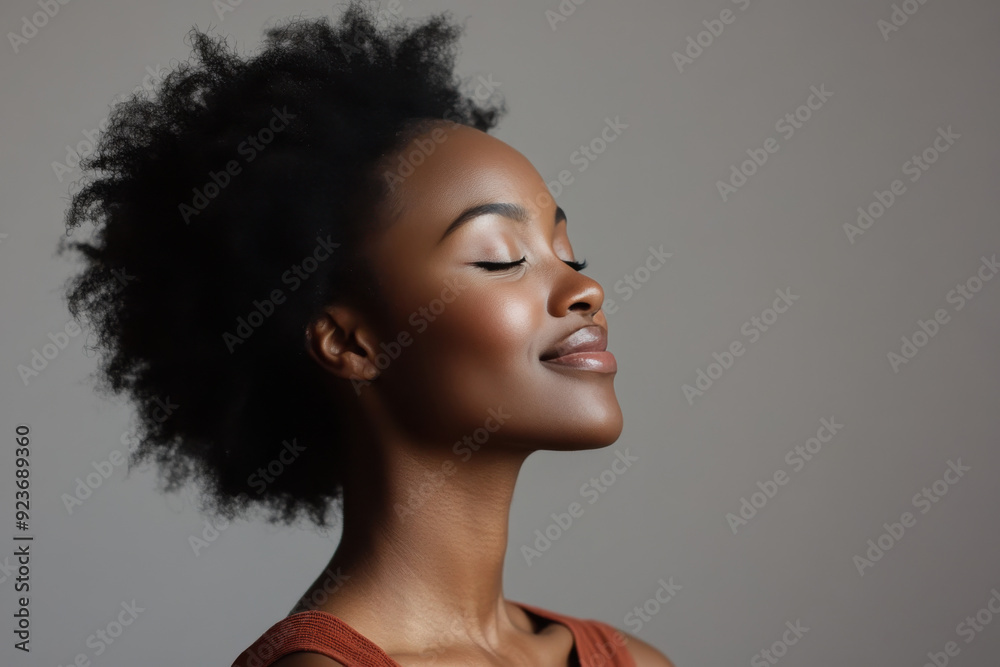 A close up of a black woman's face with her eyes closed A close up of a black woman's face with her eyes closed