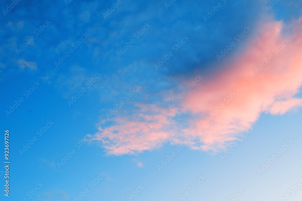 Sunset sky background with pink and blue dramatic colorful clouds, soft tones applied Sunset sky background with pink and blue dramatic colorful clouds, soft tones applied